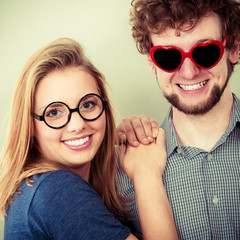 Happy couple man and woman in glasses.