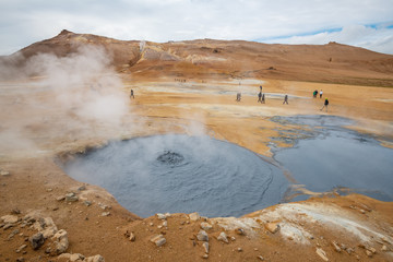 Bubbling Hot with steam. Mud Pots in the Namafjall Geothermal Area, Hverir, Iceland.