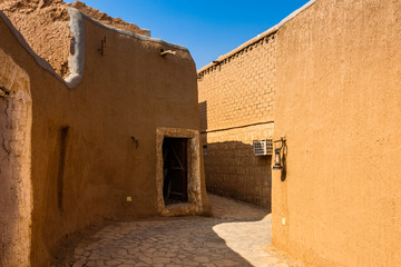A narrow street in a traditional Arab mud brick village, Al Majmaah, Saudi Arabia