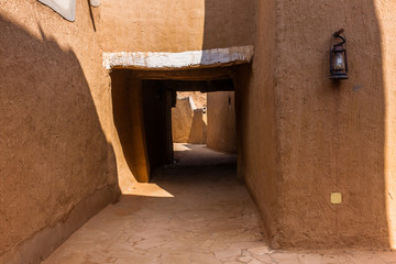 A narrow street in a traditional Arab mud brick village, Al Majmaah, Saudi Arabia