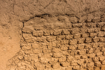 A close-up view of the brickwork of a traditional Arab mudbrick house