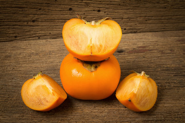 persimmon fruit ripe fresh on old wood