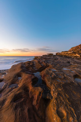 Obraz premium Morning golden light at rock cliff.