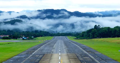 Foto auf Acrylglas Airport runway with mountain in countryside © kannika2012