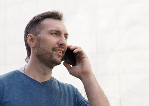 Average Man Talking On The Phone, Close Up