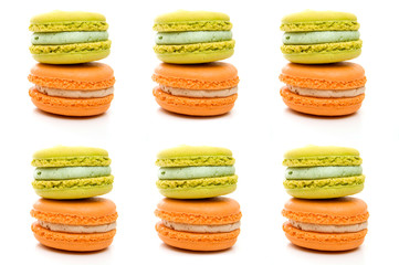 Multiple Delicious Isolated Orange and Green Stacked Macarons