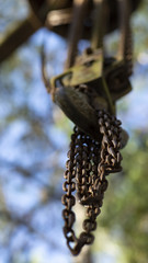 Chains attached to a hook and blurred background