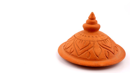 Thai pot with lid and white background.