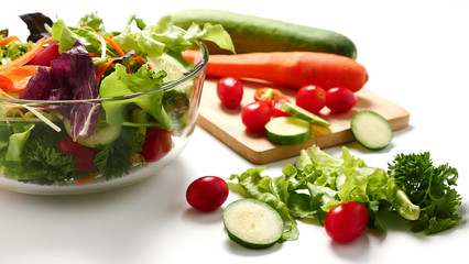 Mixed vegetables salad on white background.