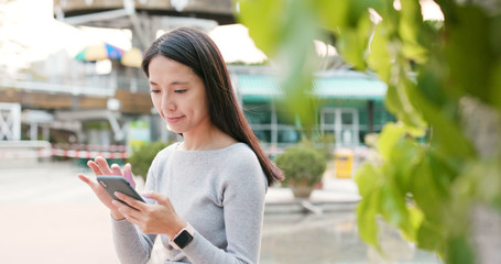 Woman use of smart phone in the city at outdoor