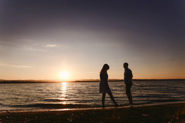 Guy and girl are on the seafront