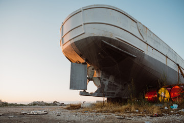 Detail of stern of the ship with propeller and rudder of old shipwreck on the coast of Greek island Zakynthos in Zakynthos harbor during the summer sunrise from low wide angle © Tomáš Hudolin
