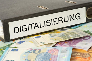 Euro Geldscheine und ein Ordner mit dem Aufdruck Digitalisierung