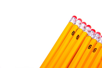 Lined up yellow pencils with pink erasers. Being prepared for school.  Taking notes or taking tests.