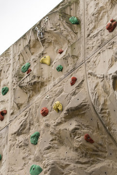 Large artificial climbing wall with carabiner.