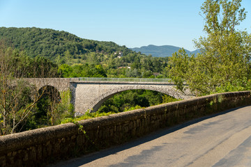 Stone bridge over the river Ardeche near Pradons in the department Ardeche