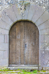 Fototapeta na wymiar old wooden door in a medieval church