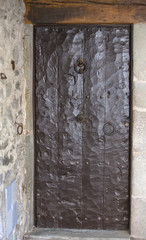 The ancient wooden door in Spain.
