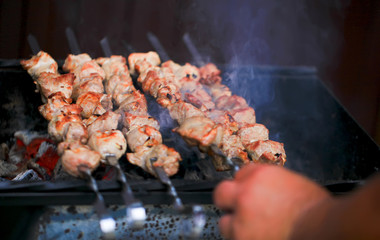 Meat And Vegetable Kebabs On The Hot BBQ Grill. Flaming Charcoal In The Background. Snack For Outdoor Summer Barbeque Party.Family dinner in the open air.