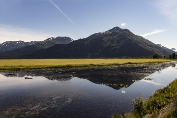 Potter Marsh, wildlife viewing area in the Anchorage area with a view of the Chugach Mountains, Alaska, USA in summertime.