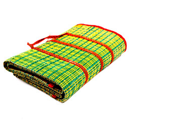 Green mats with white backdrop.