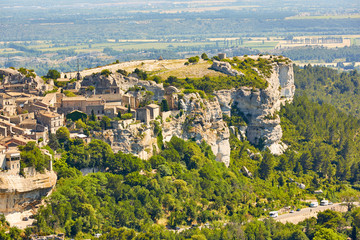 Fototapeta na wymiar Provencal village Les Baux de Provence and view of Sarragan stones