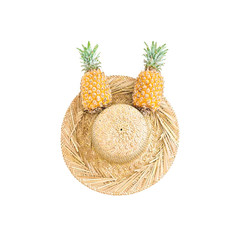 Summer concept. Pineapple fruit and straw hat on white background. Flat lay, top view.