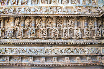 Ornate perforated window and Decorative friezes with deities, dancers and other figures, Chennakeshava temple. Belur, Karnataka.