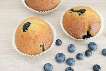 Blueberry Muffin and blueberries on wood