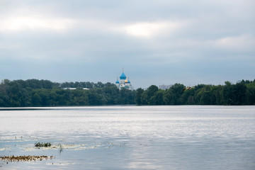 Landscape with a river, park and church building. Moscow, Russia