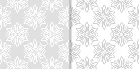 Light gray floral ornamental designs. Set of seamless patterns