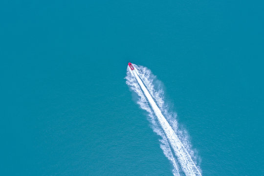 jetsky speeding on blue sea water