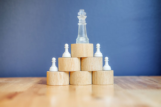 Leadership Concept as a group of chess pawn pieces planning and conspiring