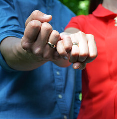 Husband and wife hold ice cream in hand