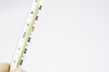 Thermometer in hand isolated white background.
