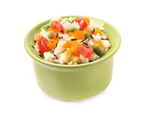 Bowl with tasty boiled rice and vegetables on white background