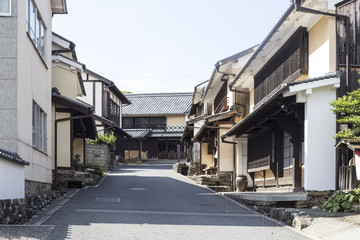 Old district wooden houses at historical Takayama town in Japan on winter day