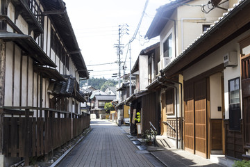 Naklejka na ściany i meble Old district wooden houses at historical Takayama town in Japan on winter day