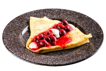 Sweet tasty crepe with cherry isolated