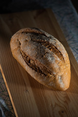 Healthy organic homemade bread on wooden table.