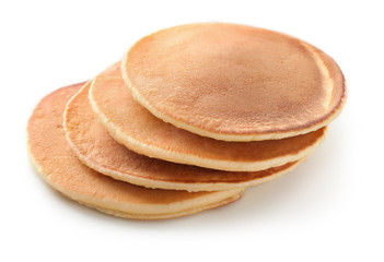 Tasty homemade pancakes on white background