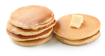 Tasty homemade pancakes with butter on white background