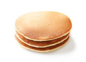Stack of tasty homemade pancakes on white background