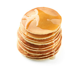 Tasty pancakes with honey on white background