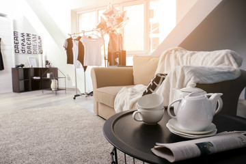 Modern interior of living room with comfortable sofa and coffee table