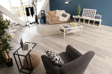 Modern interior of living room with stylish furniture