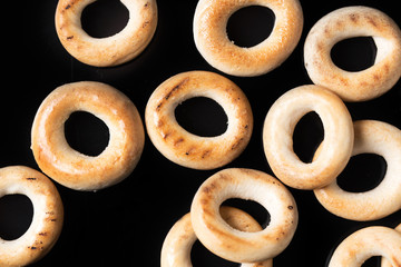 Bagels on a dark background, top view.