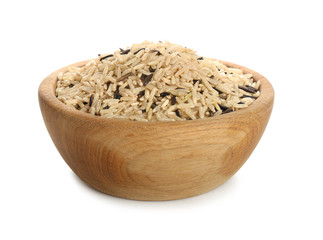 Wooden bowl with raw rice on white background