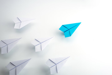 Blue paper plane leader concept, white background. - obrazy, fototapety, plakaty