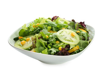Plate with healthy vegetable salad on white background